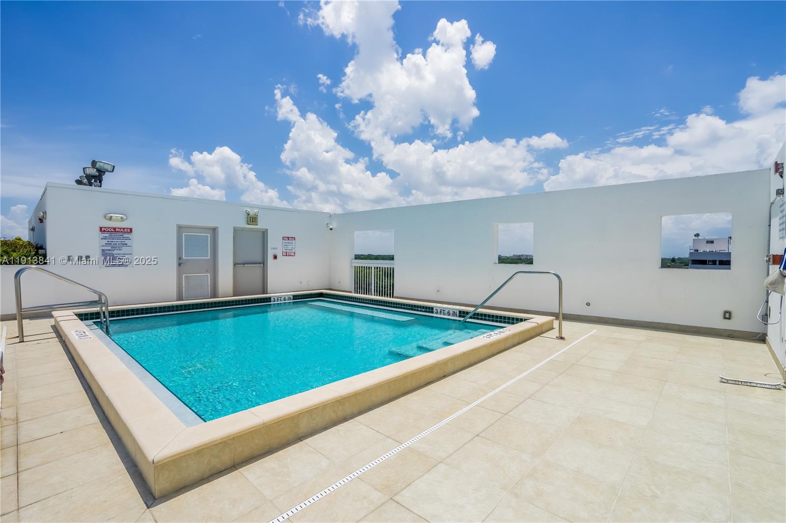 2769 Coconut Avenue, Unit 2769 Coconut Grove, FL 33133 - Photo 12 of 14 a view of a living room and chandelier