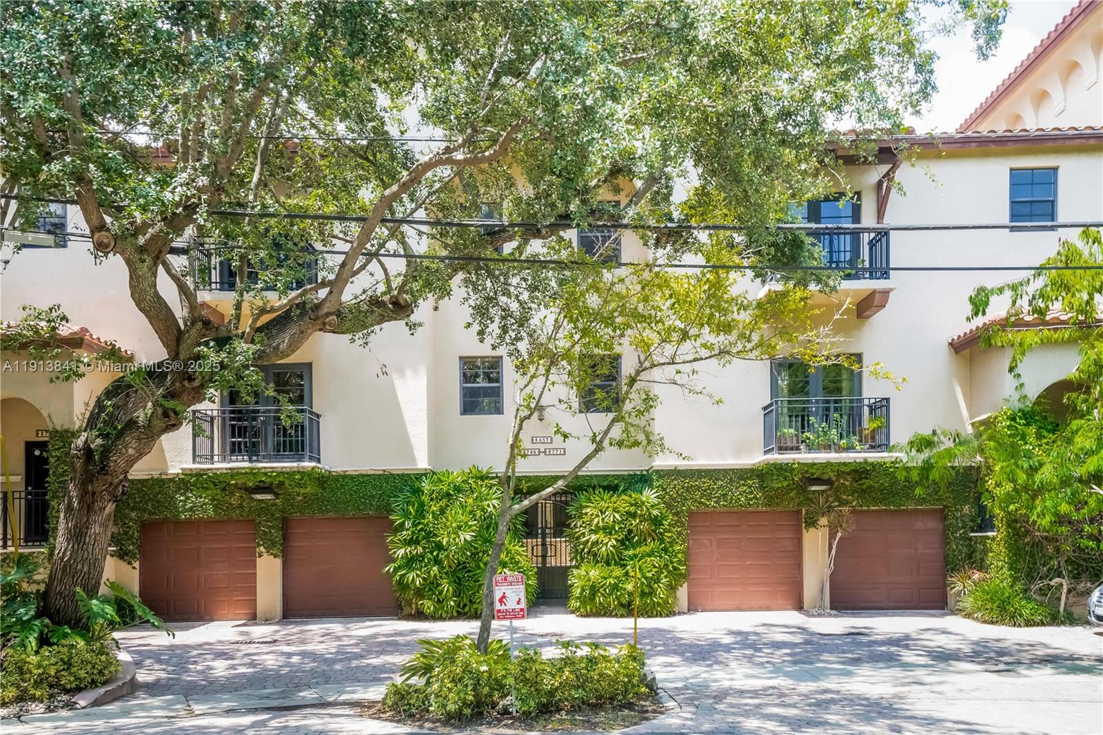 2769 Coconut Avenue, Unit 2769 Coconut Grove, FL 33133 - Photo 14 of 14 a front view of a house with a garden