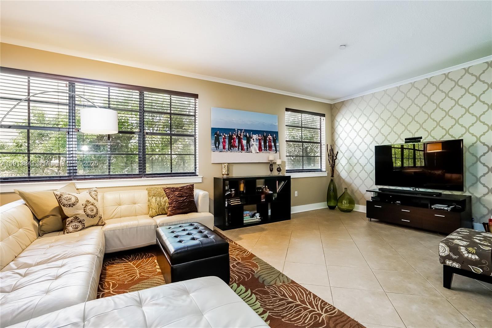 2769 Coconut Avenue, Unit 2769 Coconut Grove, FL 33133 - Photo 3 of 14 a living room with furniture and a flat screen tv
