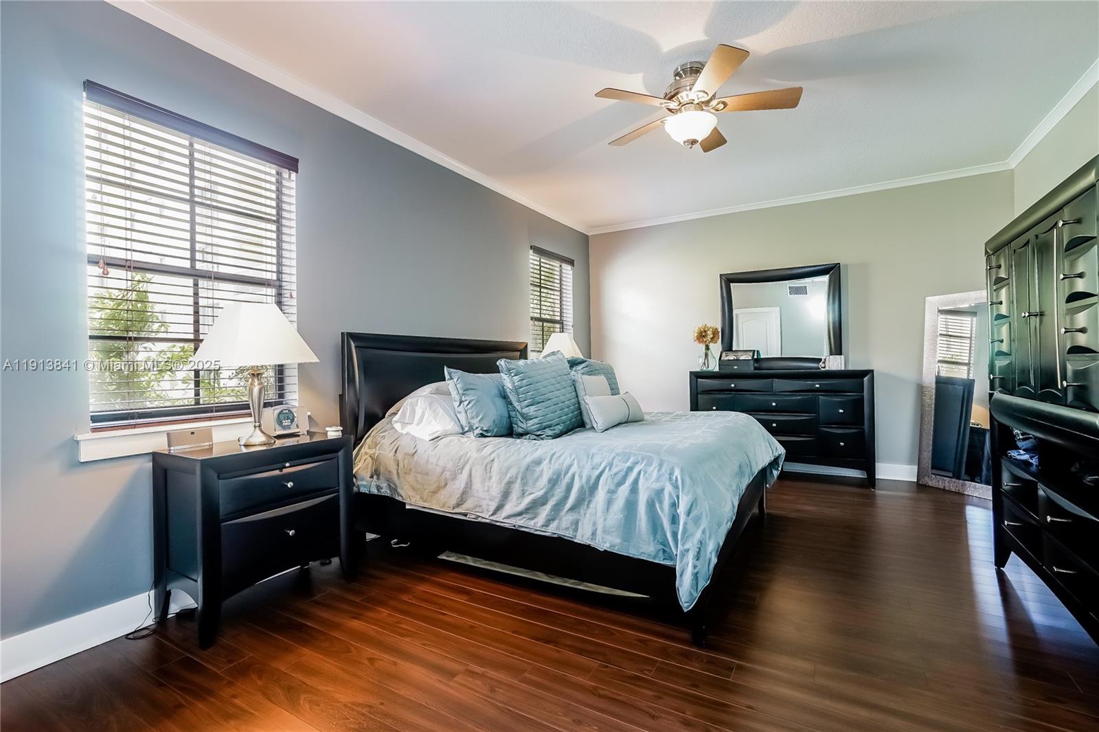 2769 Coconut Avenue, Unit 2769 Coconut Grove, FL 33133 - Photo 9 of 14 a spacious bedroom with a bed and a chandelier