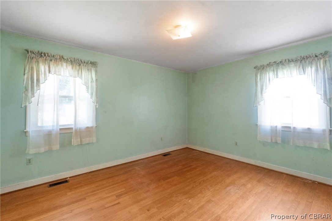 3721 Winterhaven Road Midlothian, VA 23112 - Photo 18 of 25 Empty room with hardwood / wood-style floors