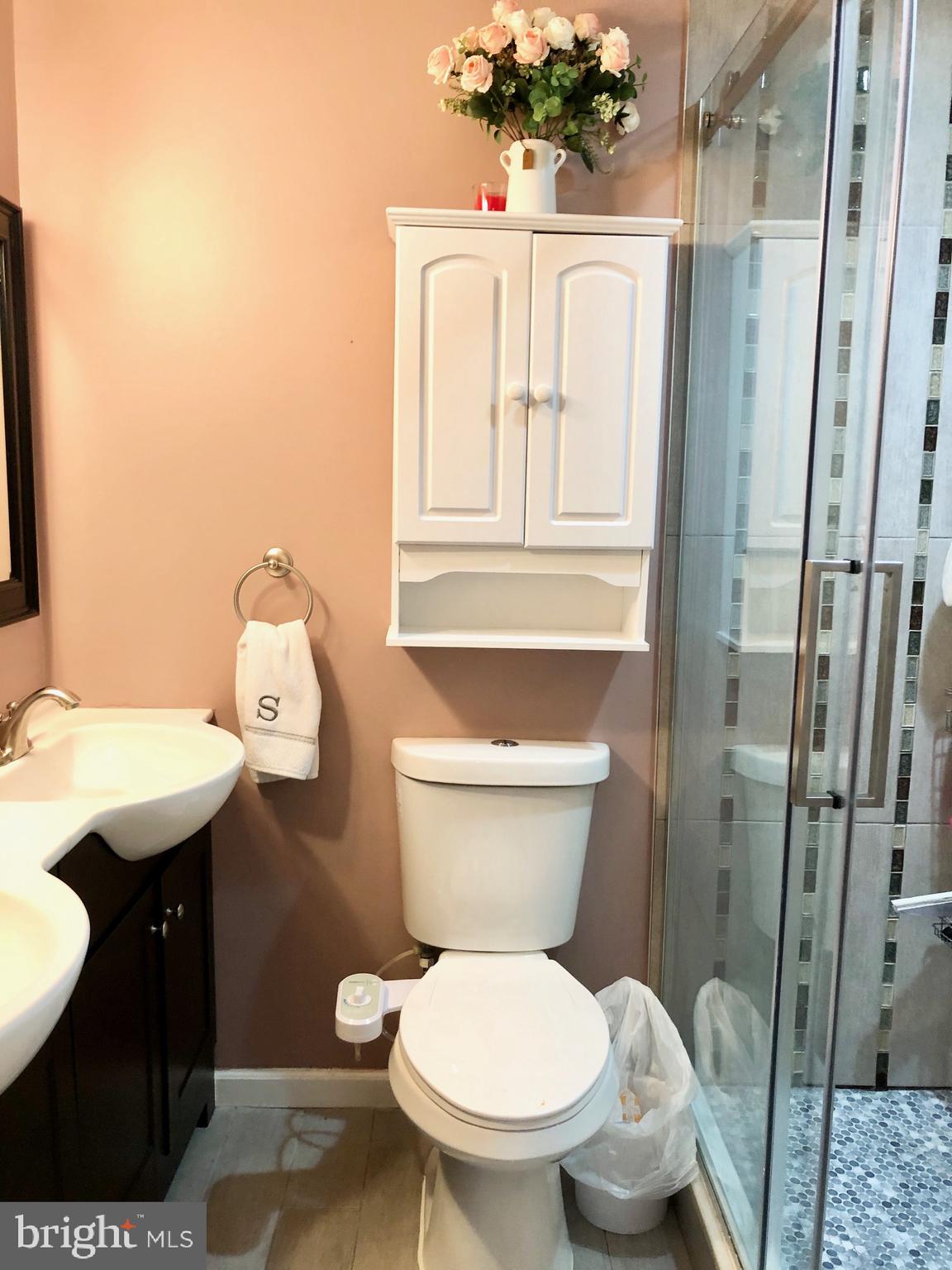 53 Goodturn Road Levittown, PA 19057 - Photo 22 of 42 a bathroom with a toilet a sink and mirror