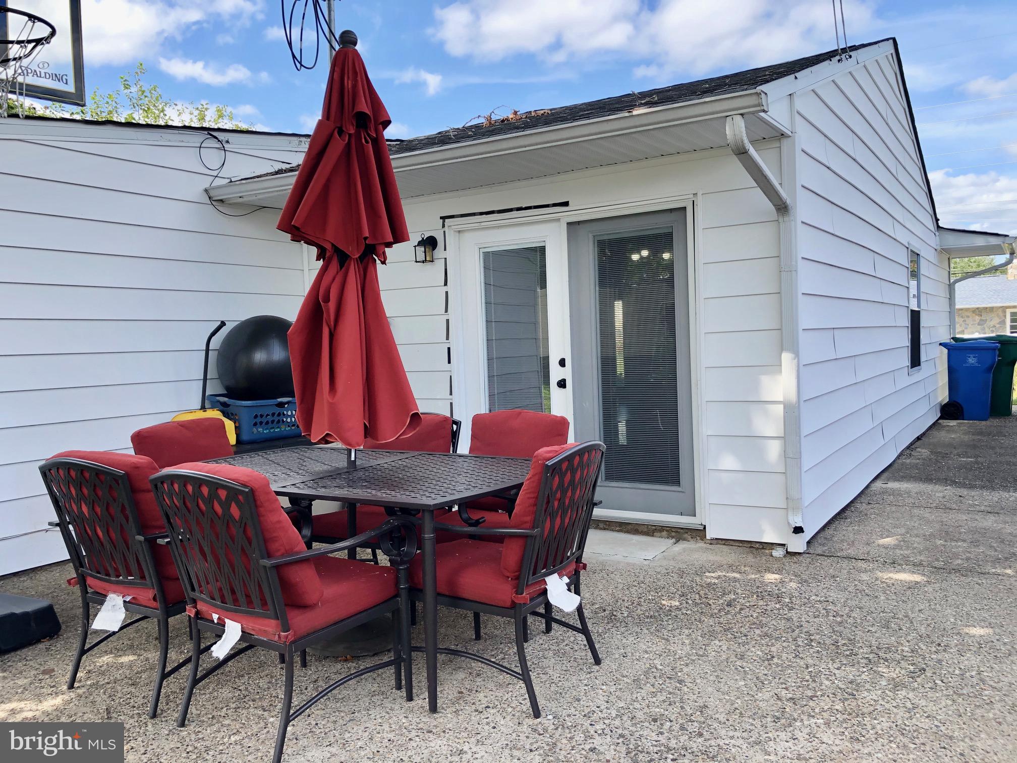 53 Goodturn Road Levittown, PA 19057 - Photo 40 of 42 a view of a chairs and tables in patio