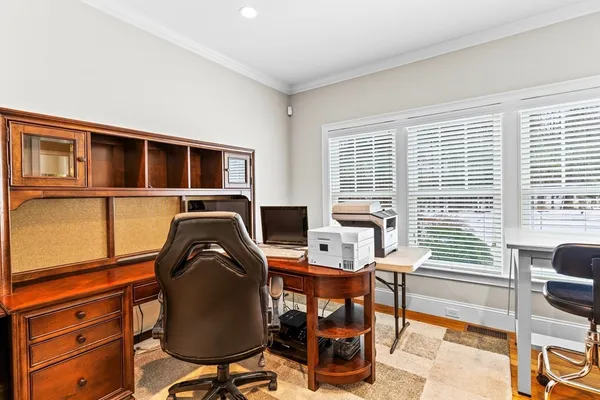 a workspace with furniture and a window