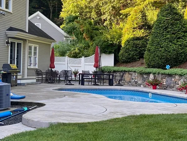 a front view of house with yard and outdoor seating
