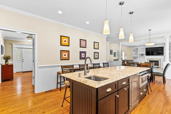 a kitchen with a sink a counter top space and stainless steel appliances