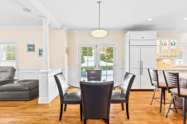 a view of a dining room with furniture window and wooden floor
