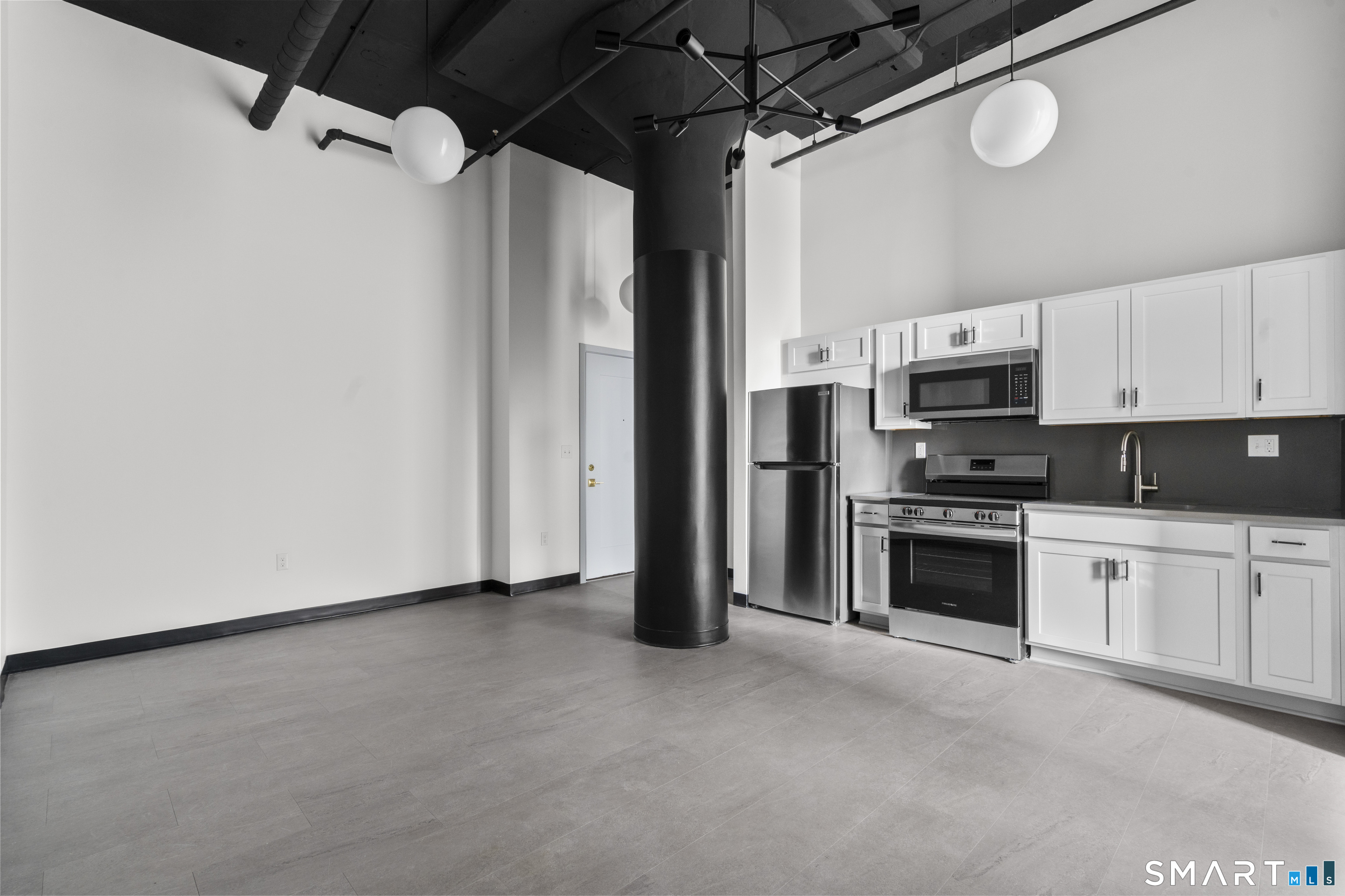 480 Myrtle Street, Unit 404 New Britain, CT 06053 - Photo 2 of 18 a view of a kitchen with electric appliances