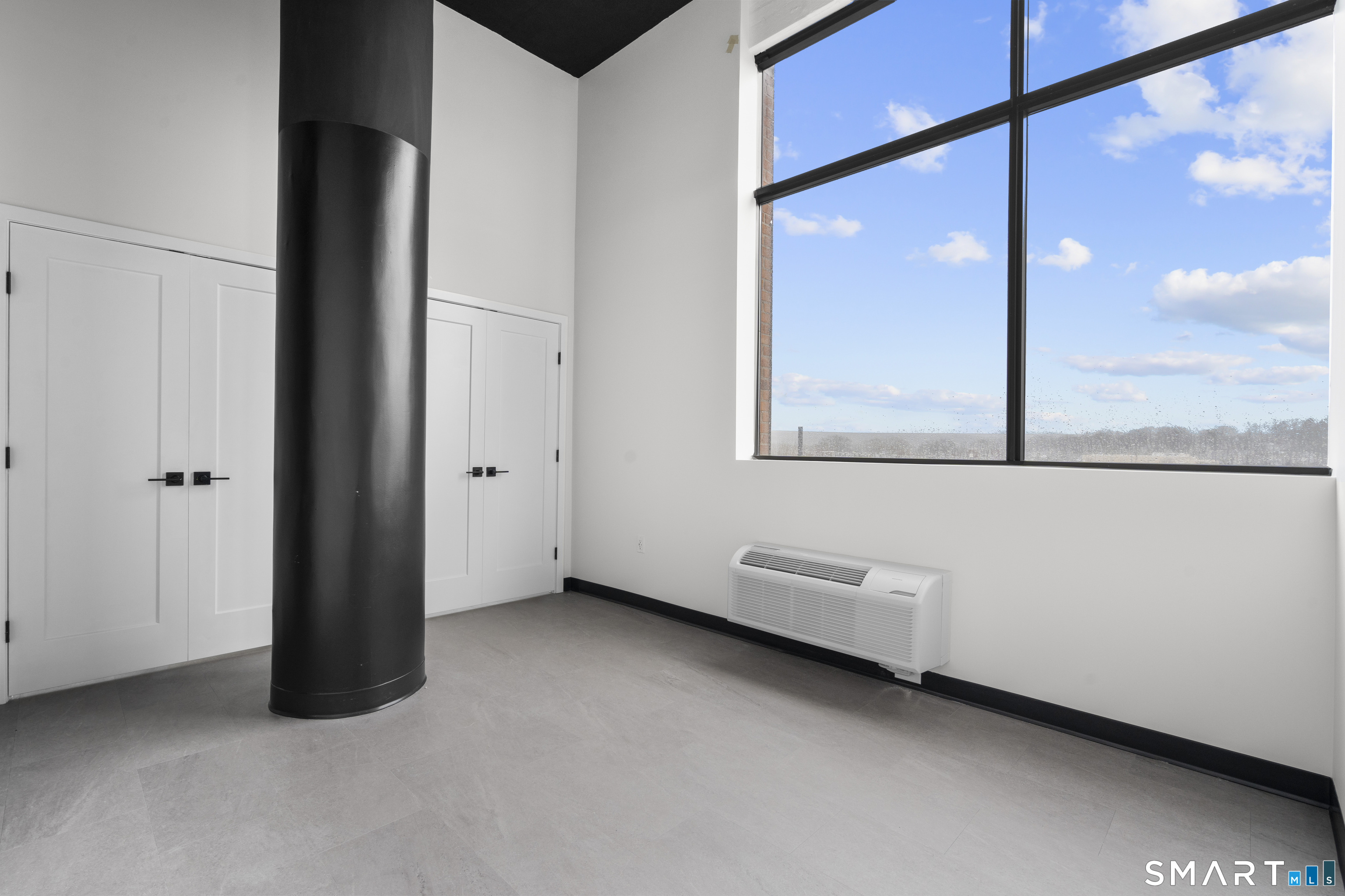 480 Myrtle Street, Unit 404 New Britain, CT 06053 - Photo 5 of 18 a view of an empty room with a window