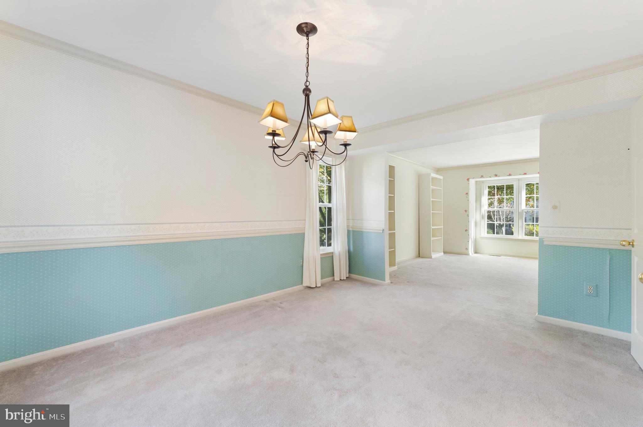 9304 Bellbeck Road Baltimore, MD 21234 - Photo 11 of 37 a view of a room with a chandelier and windows