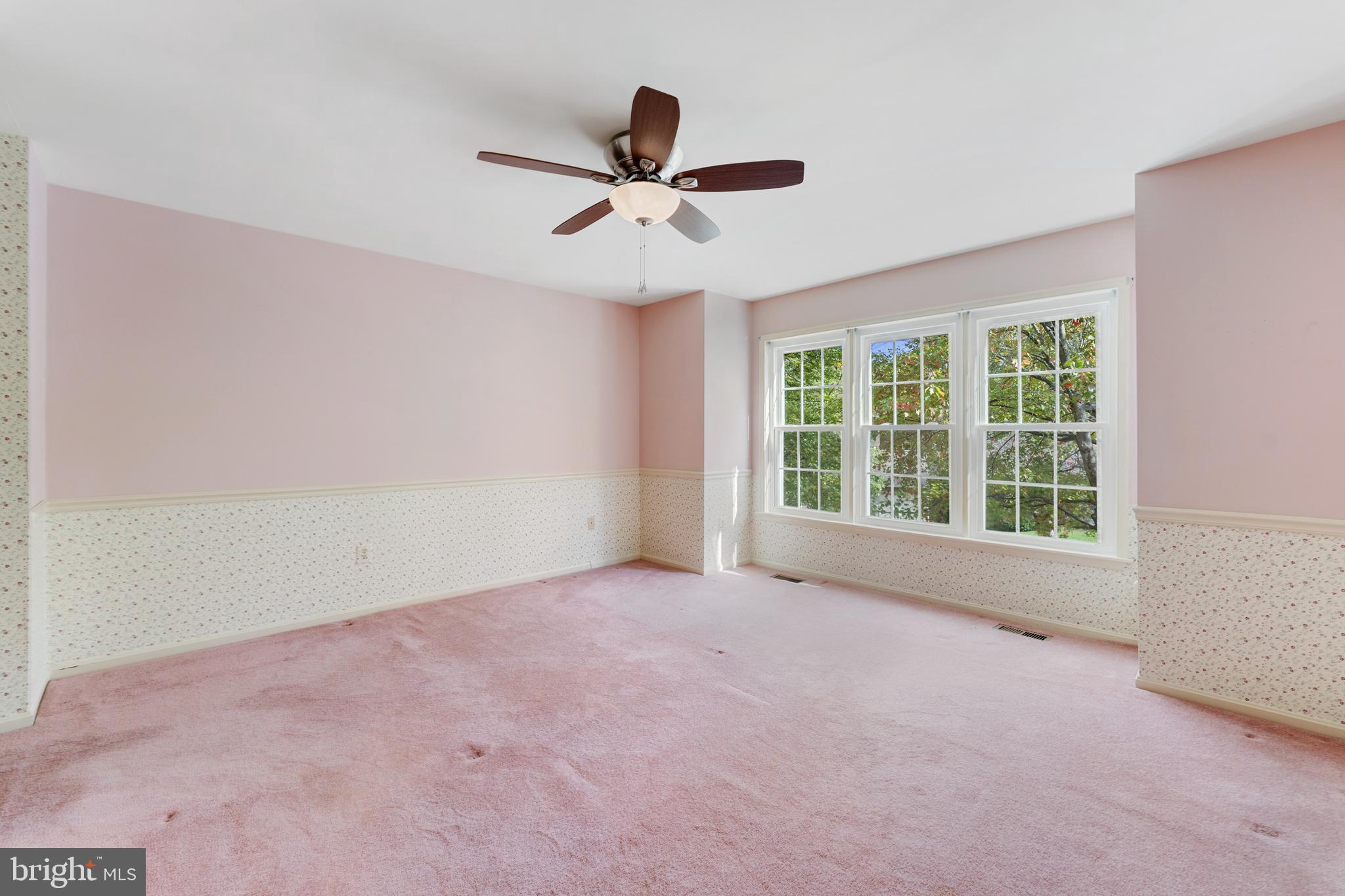 9304 Bellbeck Road Baltimore, MD 21234 - Photo 19 of 37 a view of empty room with wooden floor and fan