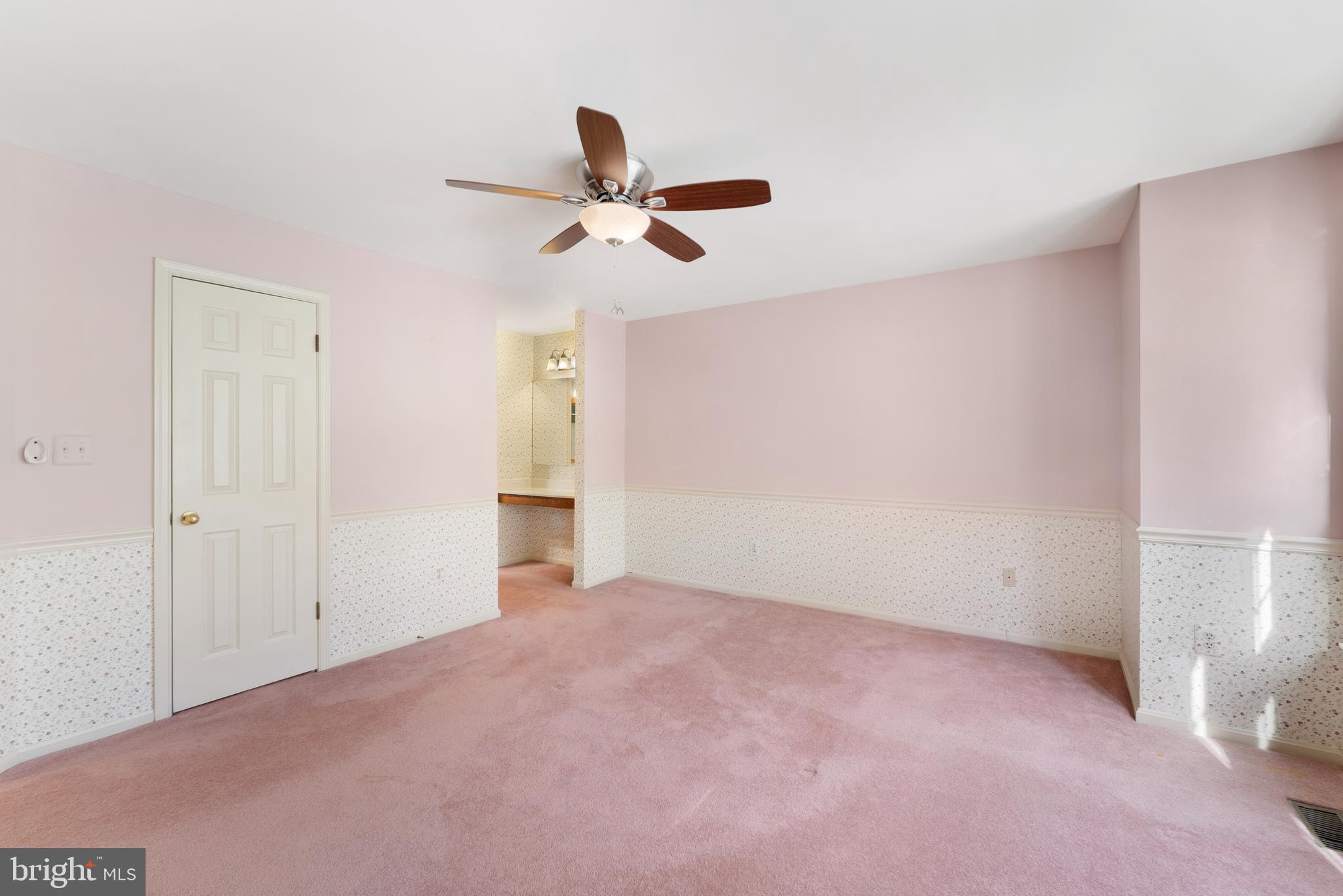 9304 Bellbeck Road Baltimore, MD 21234 - Photo 21 of 37 a view of a livingroom with a ceiling fan and window