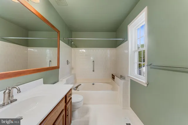 a bathroom with a bathtub and a sink