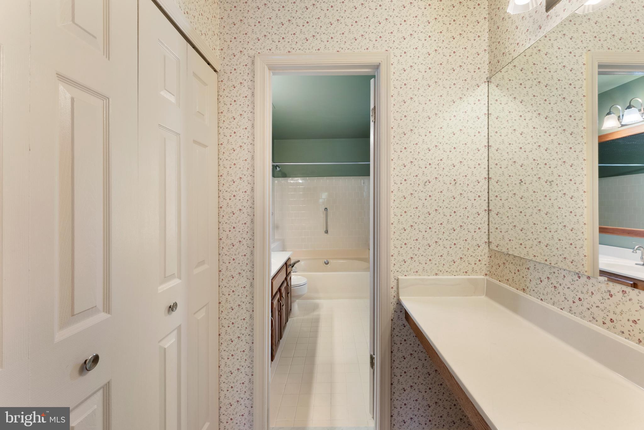 9304 Bellbeck Road Baltimore, MD 21234 - Photo 24 of 37 a bathroom with a granite countertop sink a toilet and shower