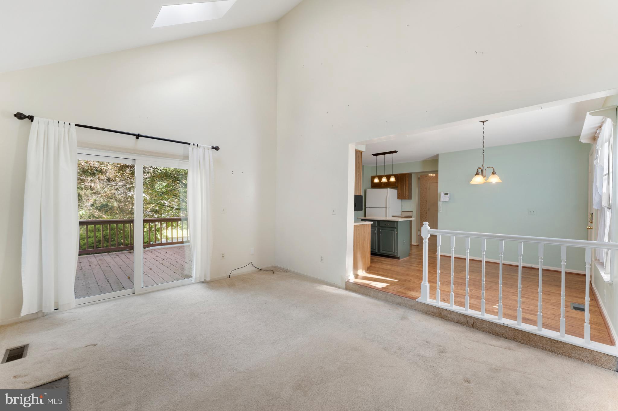 9304 Bellbeck Road Baltimore, MD 21234 - Photo 5 of 37 an empty room with fireplace and windows
