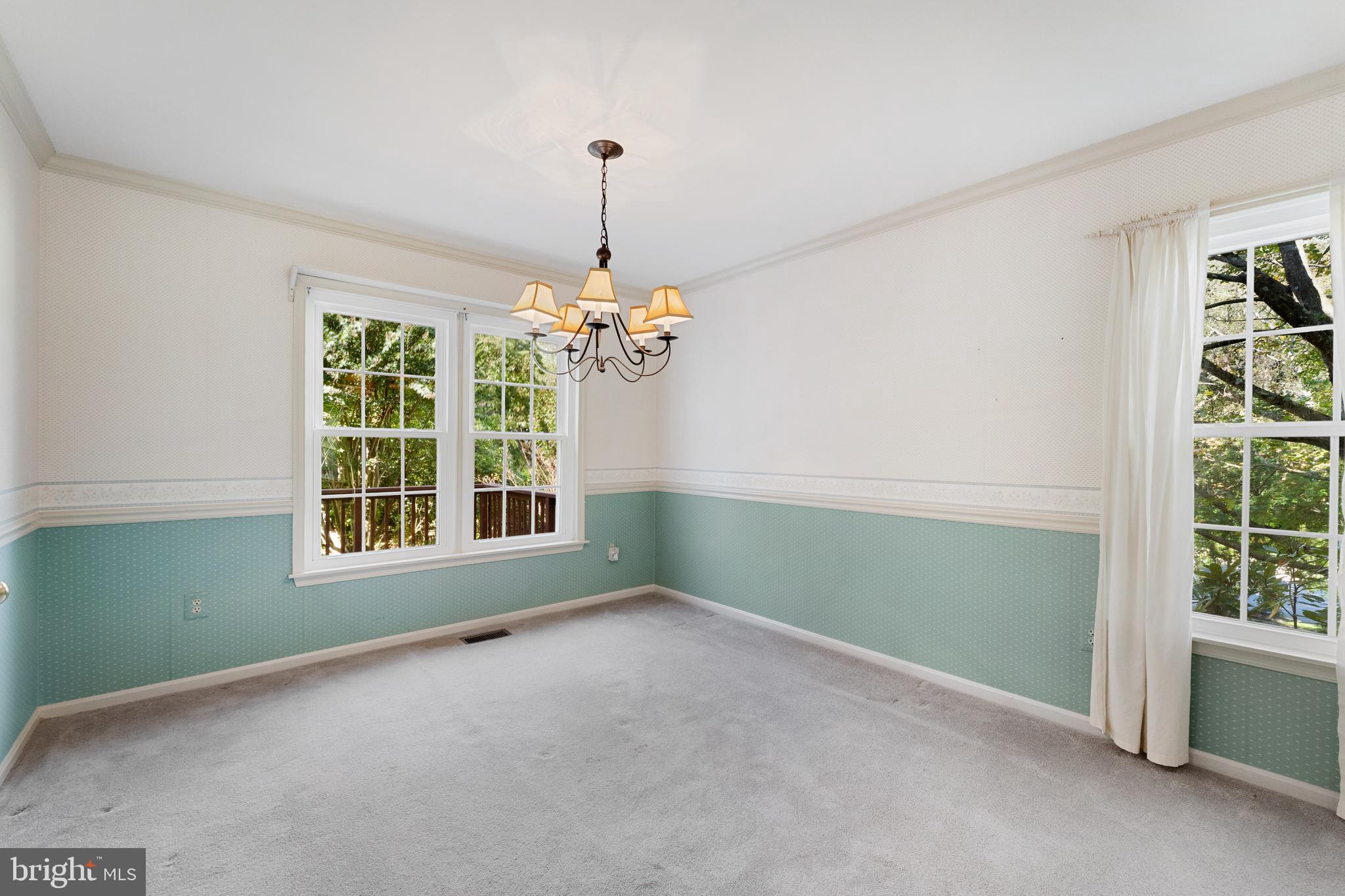 9304 Bellbeck Road Baltimore, MD 21234 - Photo 9 of 37 a view of an empty room with a window