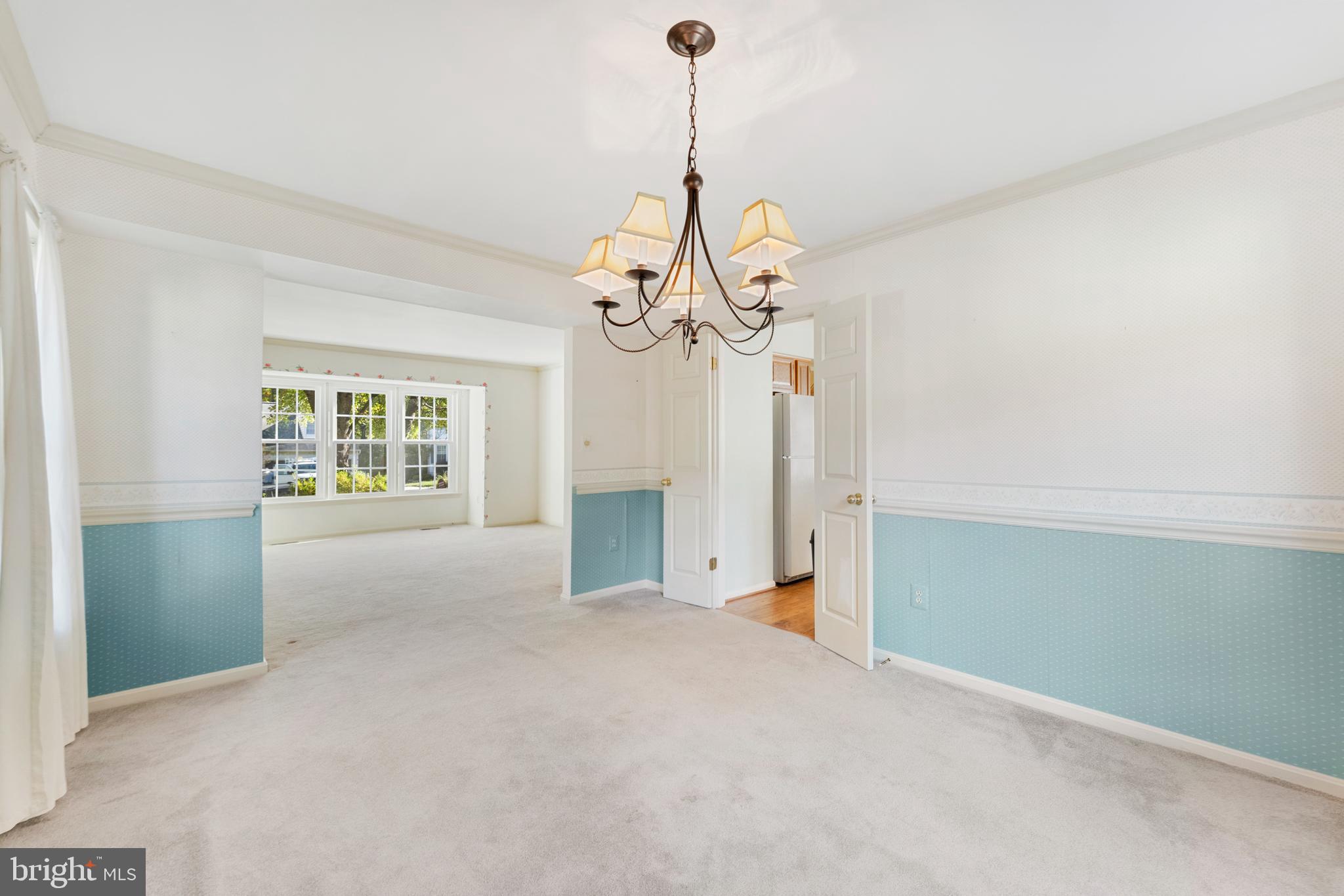 9304 Bellbeck Road Baltimore, MD 21234 - Photo 10 of 37 a view of an empty room with a chandelier fan