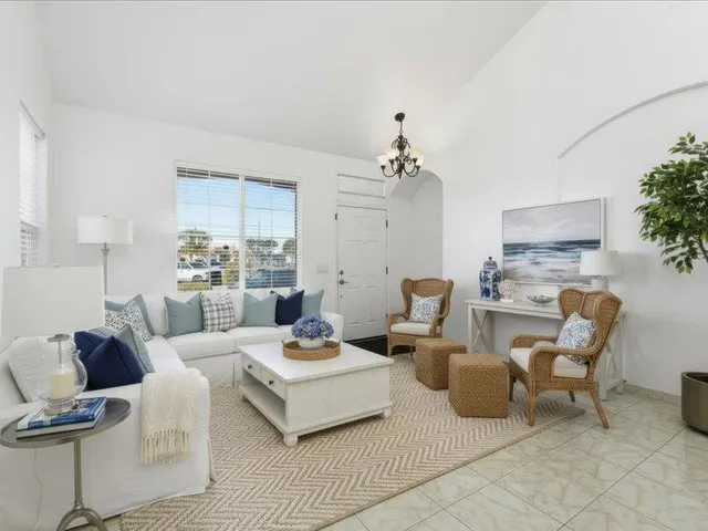 a living room with furniture and a table