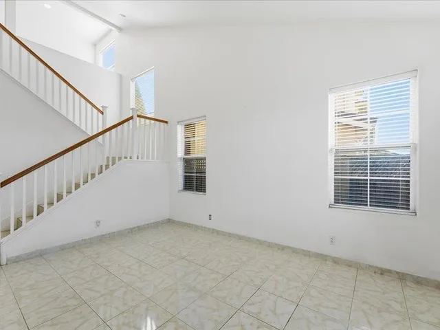 a view of an empty room with stairs