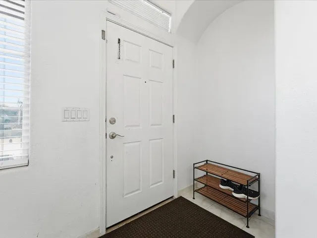 a room with a bed and a window