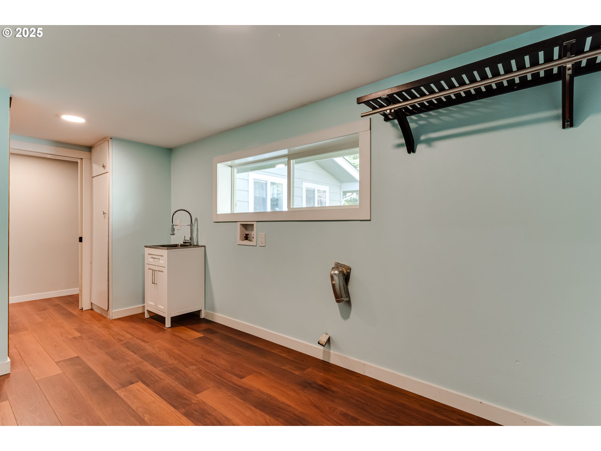 24531 Vaughn Road Veneta, OR 97487 - Photo 21 of 47 a view of a room with rack on the wall and a window