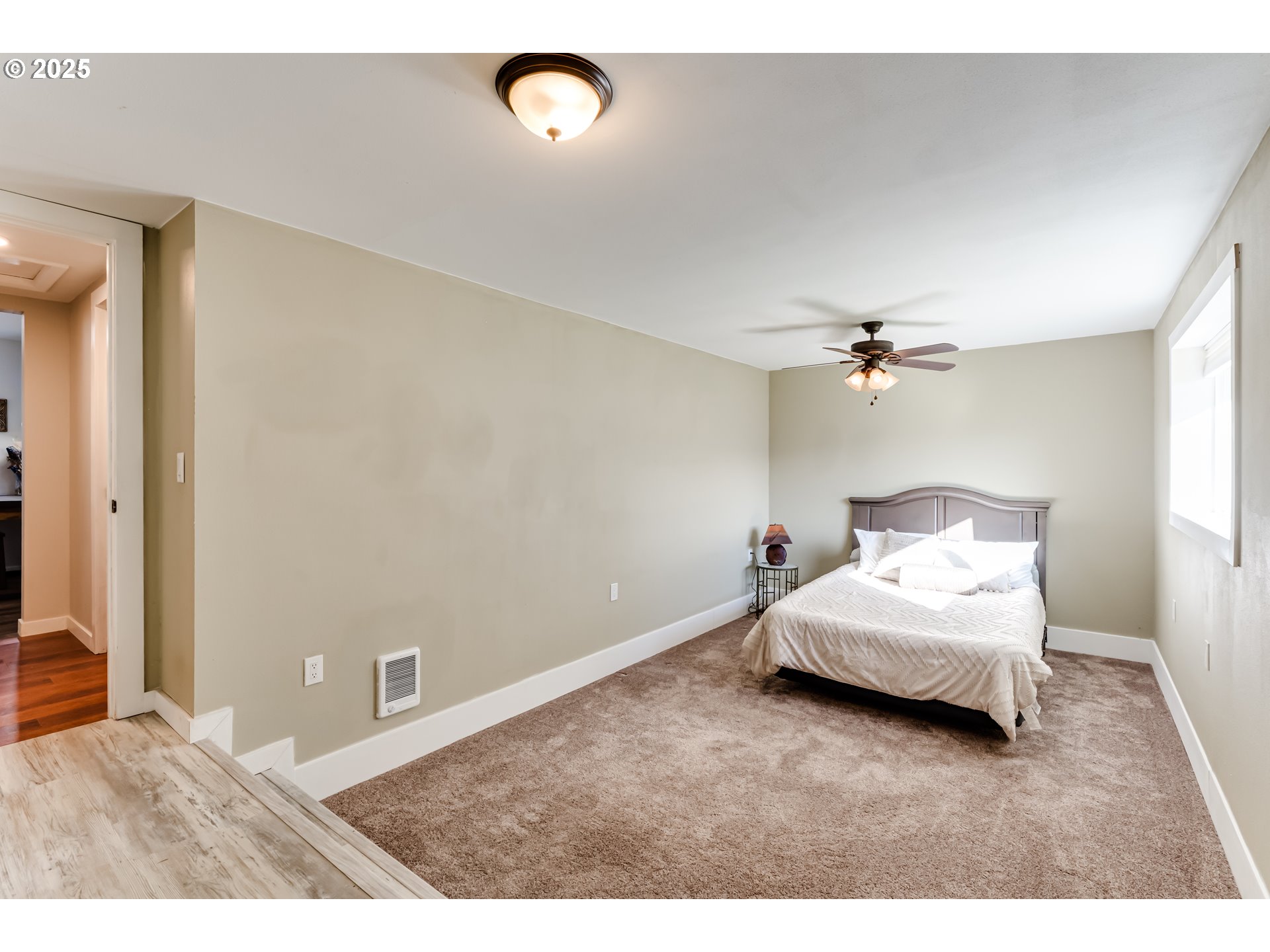 24531 Vaughn Road Veneta, OR 97487 - Photo 22 of 47 a bedroom with a bed and a ceiling fan