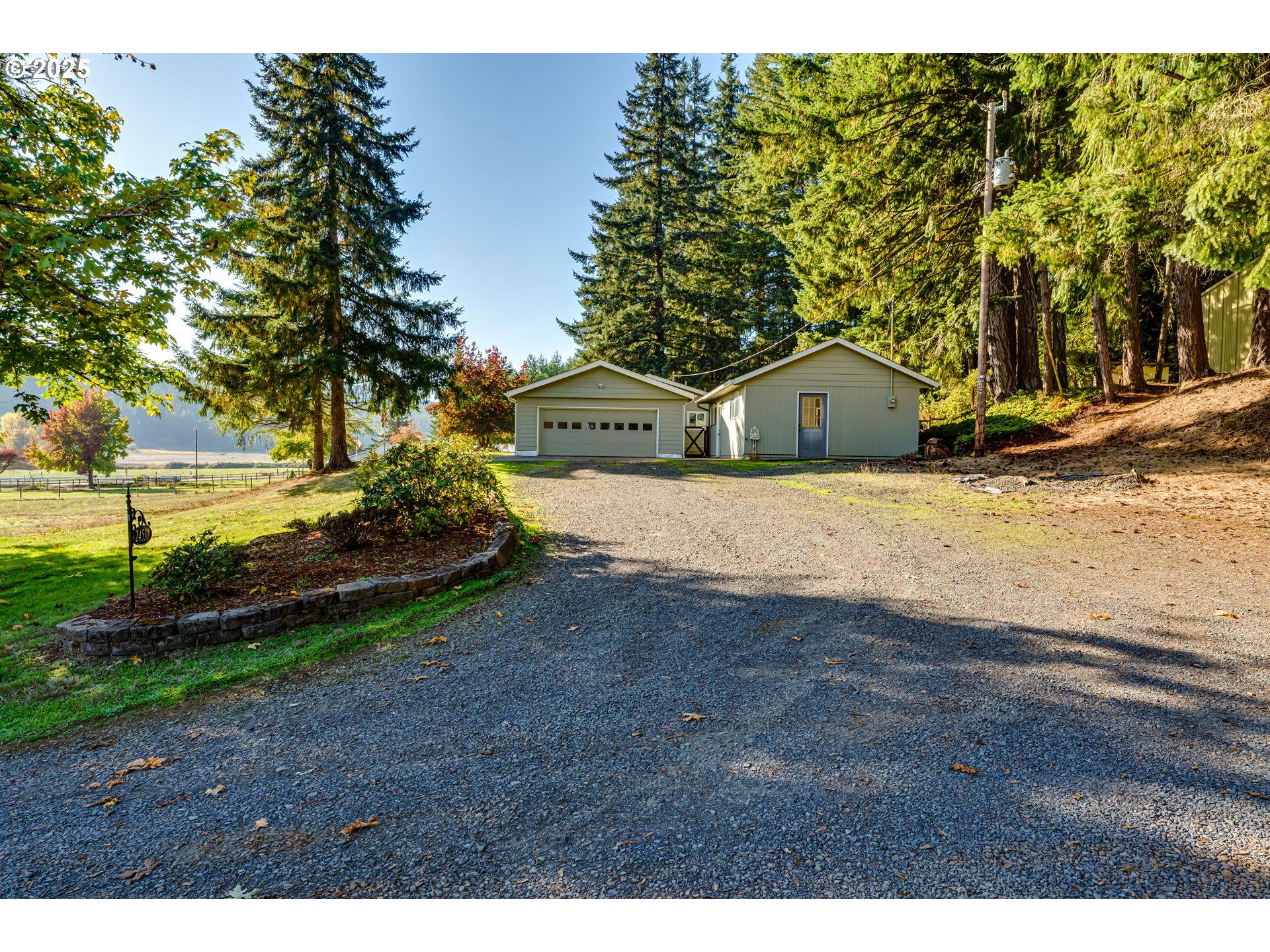 24531 Vaughn Road Veneta, OR 97487 - Photo 3 of 47 a view of a yard with a house in the background