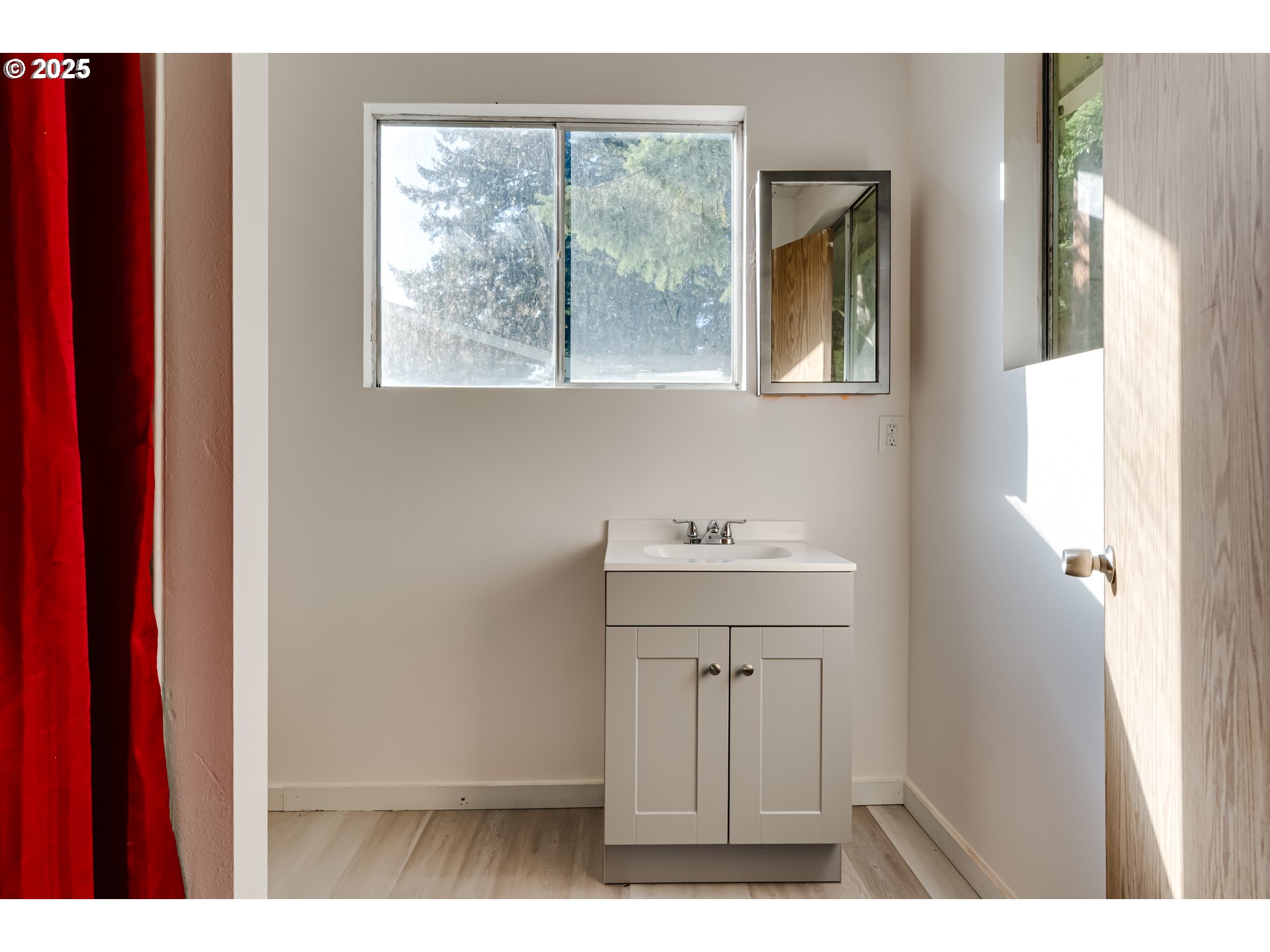 24531 Vaughn Road Veneta, OR 97487 - Photo 40 of 47 a bathroom with a sink and a window