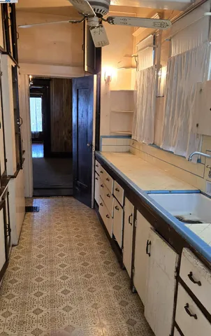 a bathroom with mirror and shower