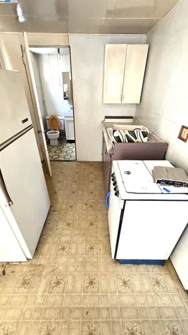 a bathroom with a sink toilet a mirror and bathtub