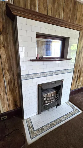 a living room with a fireplace and a fireplace