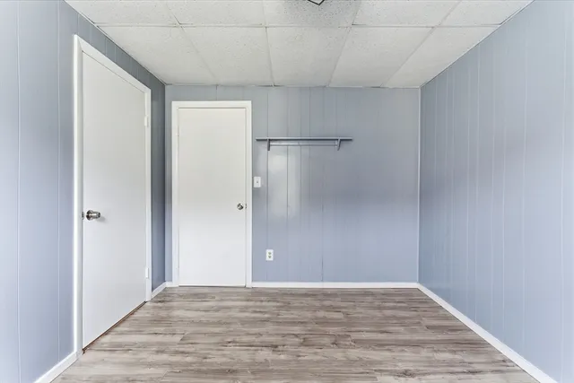 a view of a room with wooden floor
