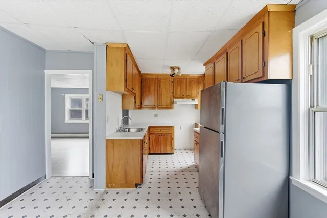 a kitchen with stainless steel appliances a refrigerator and a stove