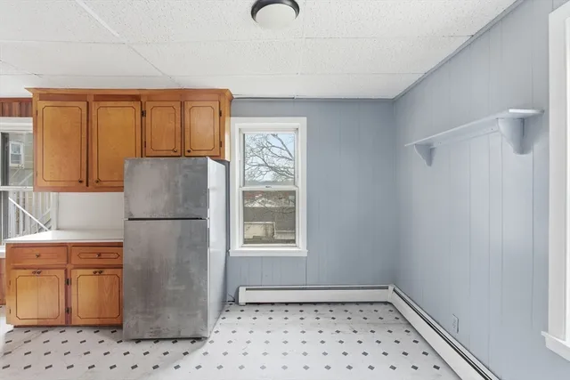 a white refrigerator freezer sitting inside of a kitchen