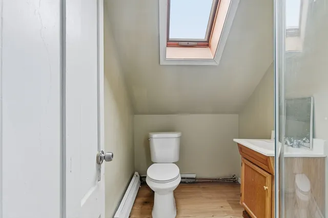 a bathroom with a toilet and a sink