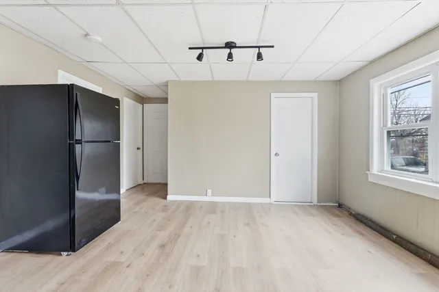 a view of an empty room with a window