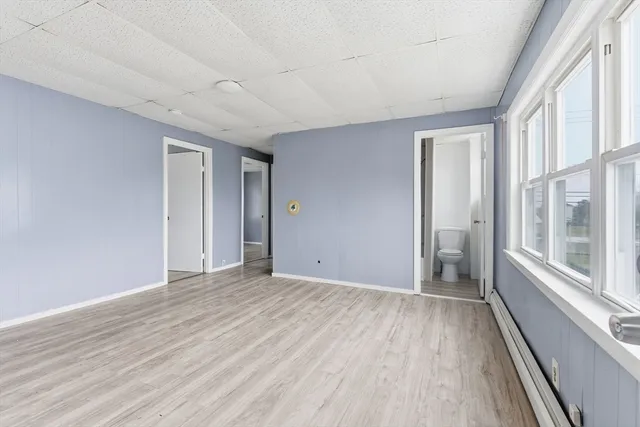 a view of an empty room with a window