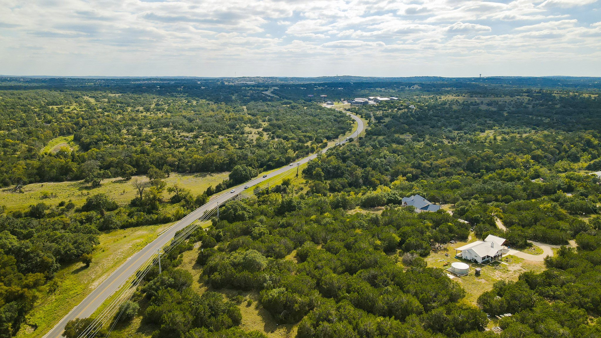 31171 Ranch Road 12 Dripping Springs, TX 78620 - Photo 1 of 21 a view of a city with an ocean