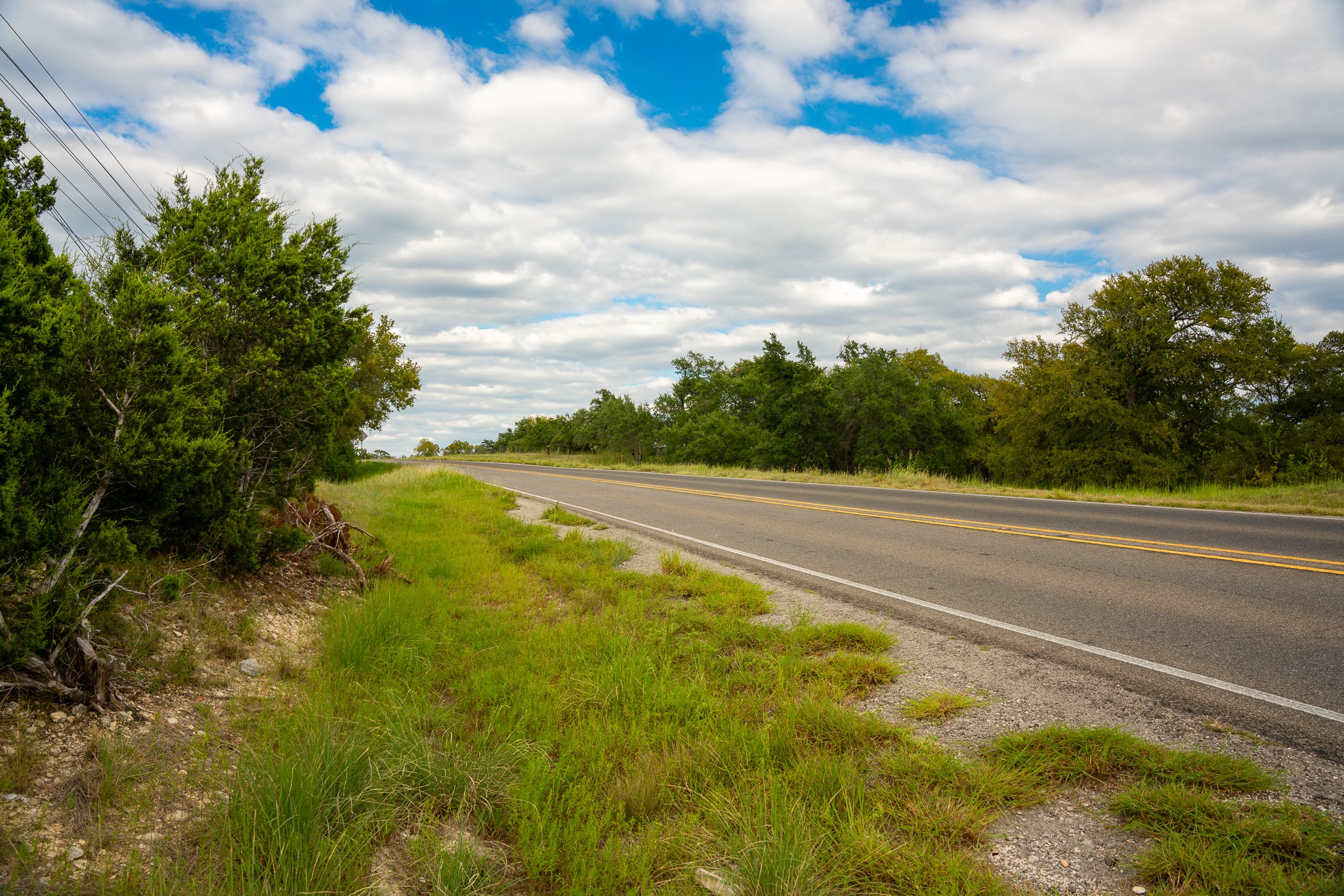 31171 Ranch Road 12 Dripping Springs, TX 78620 - Photo 15 of 21 a view of a yard with yellow lighting