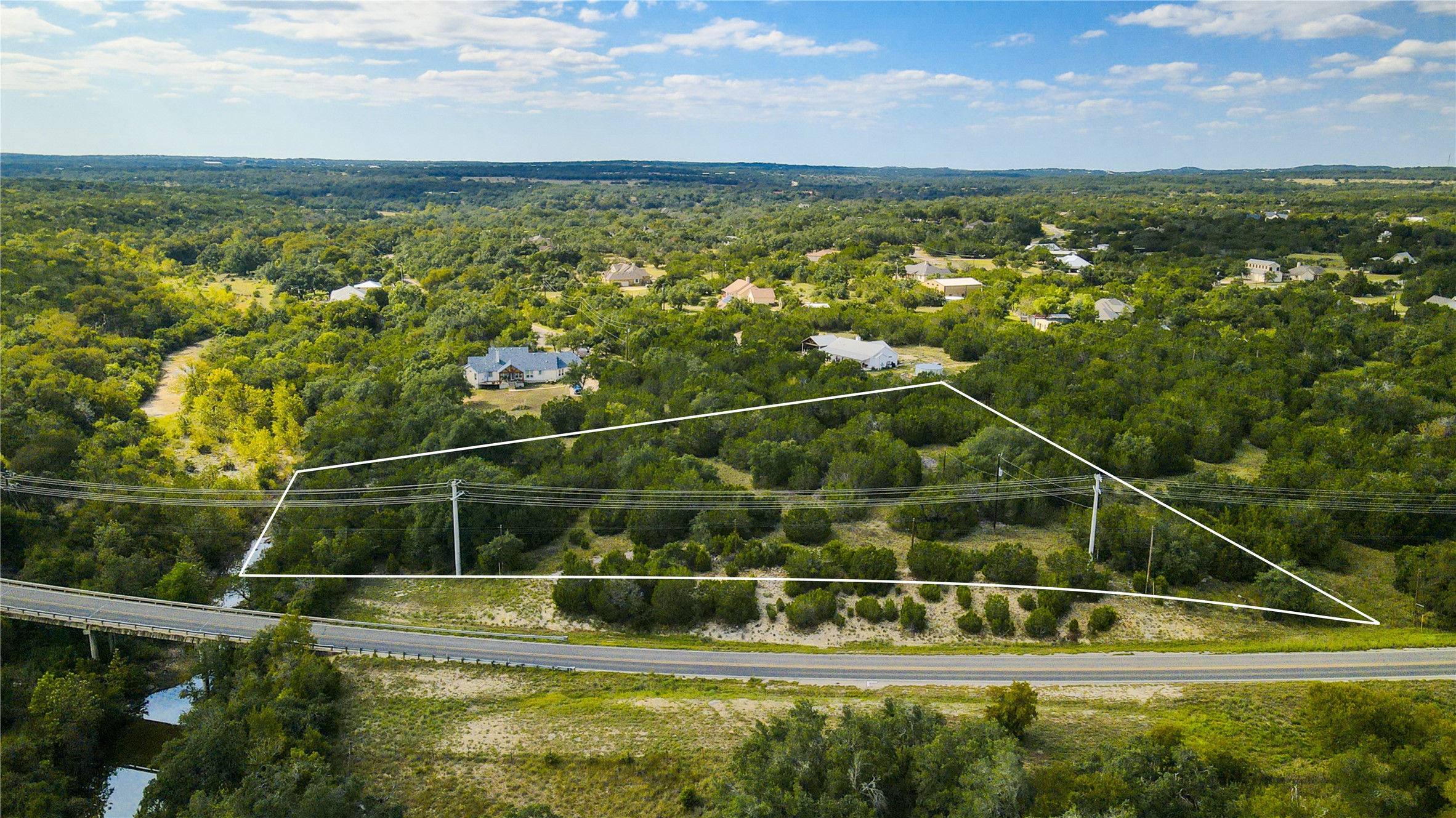 31171 Ranch Road 12 Dripping Springs, TX 78620 - Photo 5 of 21 a view of a swimming pool with a lake view