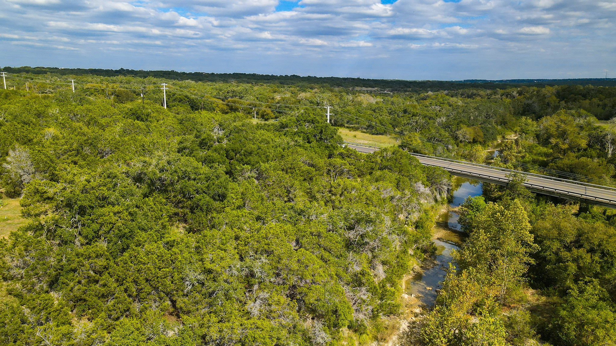 31171 Ranch Road 12 Dripping Springs, TX 78620 - Photo 10 of 21 a view of a lake from a yard