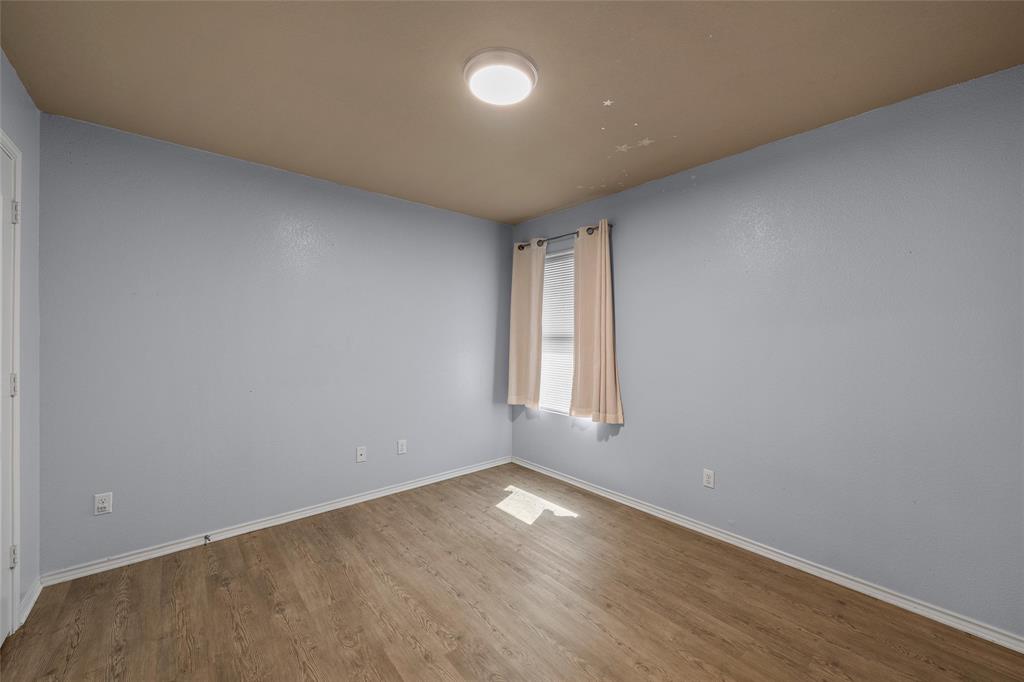 10321 Walley Way Waco, TX 76708 - Photo 13 of 19 an empty room with a empty space and a window
