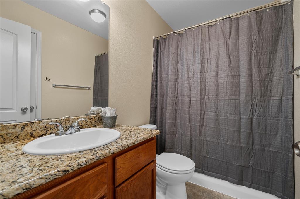 10321 Walley Way Waco, TX 76708 - Photo 14 of 19 a bathroom with a granite countertop sink and a mirror