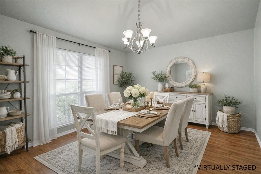 10321 Walley Way Waco, TX 76708 - Photo 3 of 19 a view of a dining room with furniture a rug and wooden floor