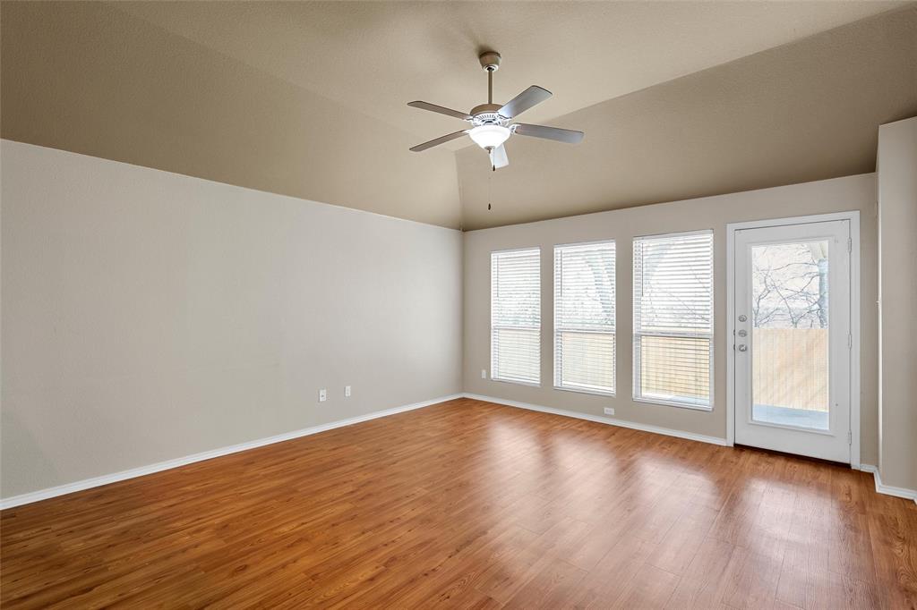 10321 Walley Way Waco, TX 76708 - Photo 5 of 19 a view of an empty room with wooden floor and a window