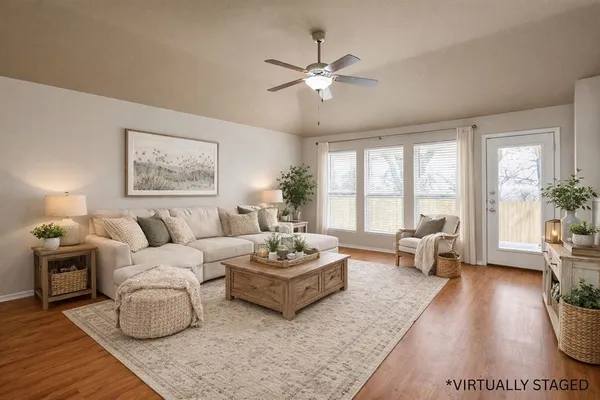 a living room with furniture and a large window