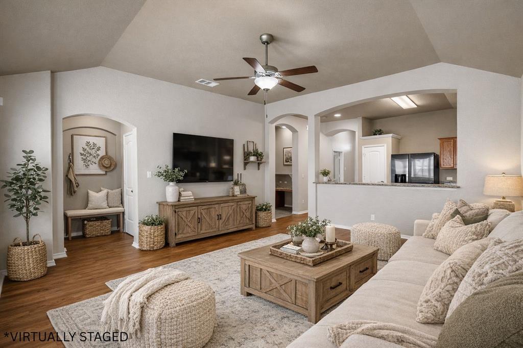 10321 Walley Way Waco, TX 76708 - Photo 8 of 19 a living room with furniture a flat screen tv and a chandelier