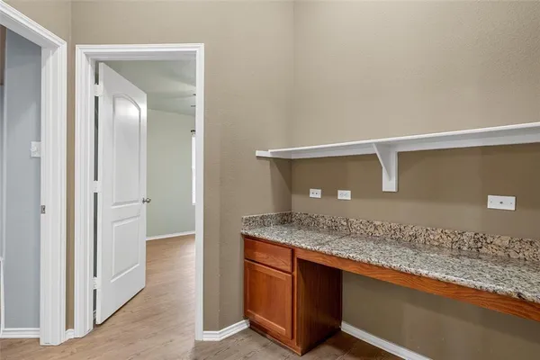 a bathroom with a granite countertop sink and vanity