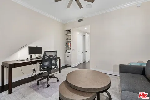 a living room with furniture and a chair