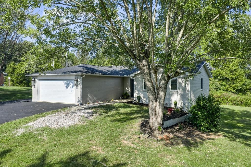 3766 Old Bridge Road Cookeville, TN 38506 - Photo 1 of 88 a house that has a tree in front of the house